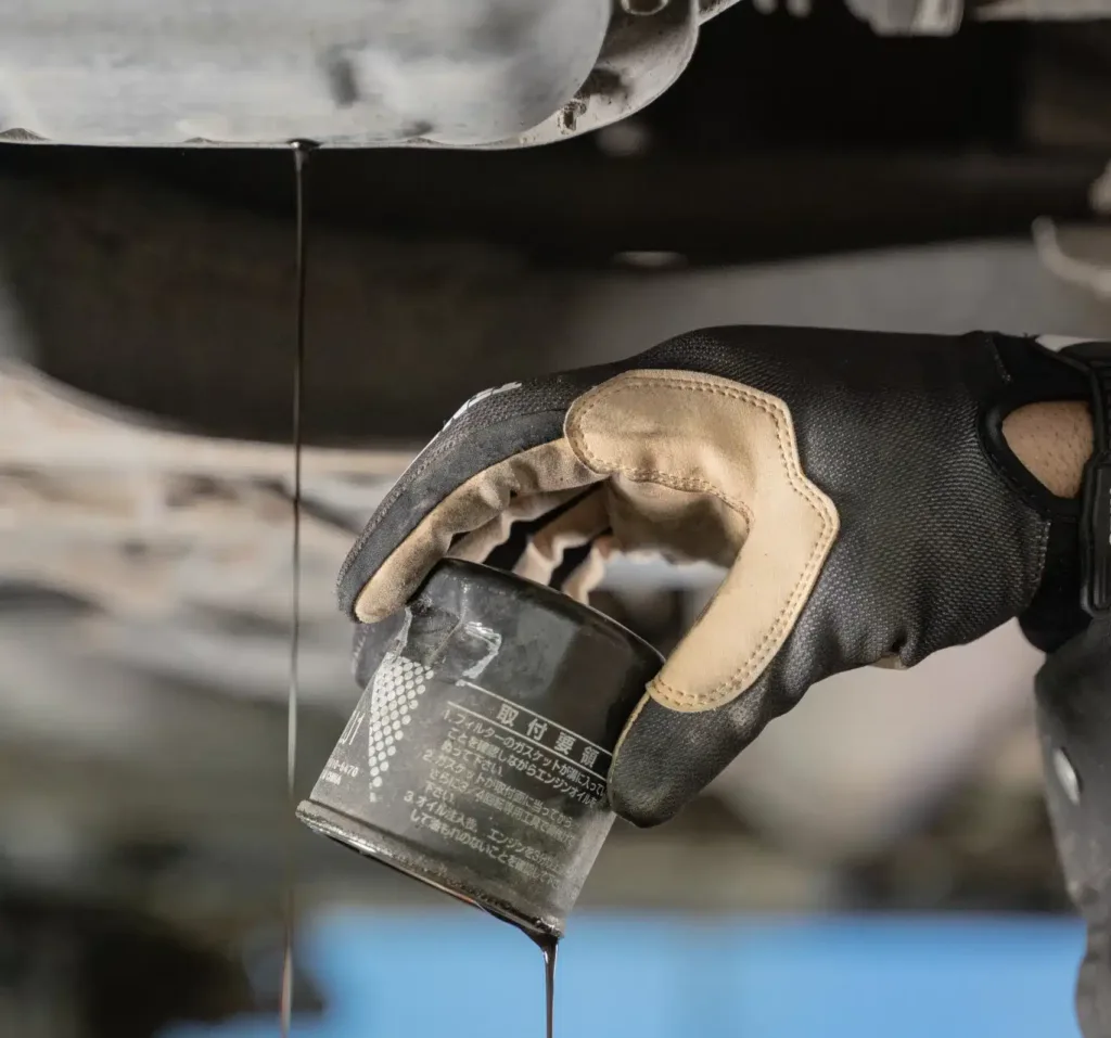 mechanic changing oil